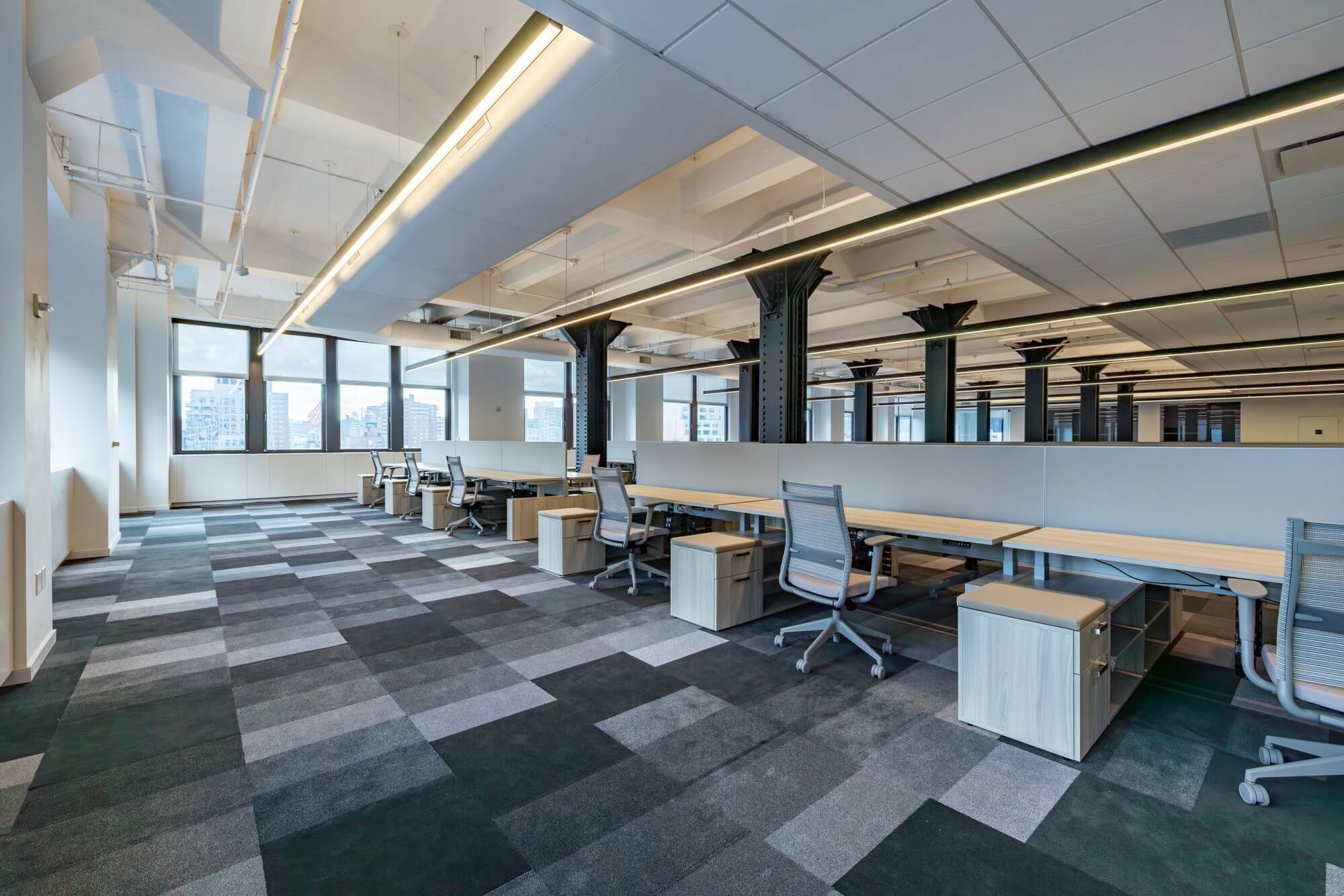 Move-in ready open concept workspace with black metal pillars 