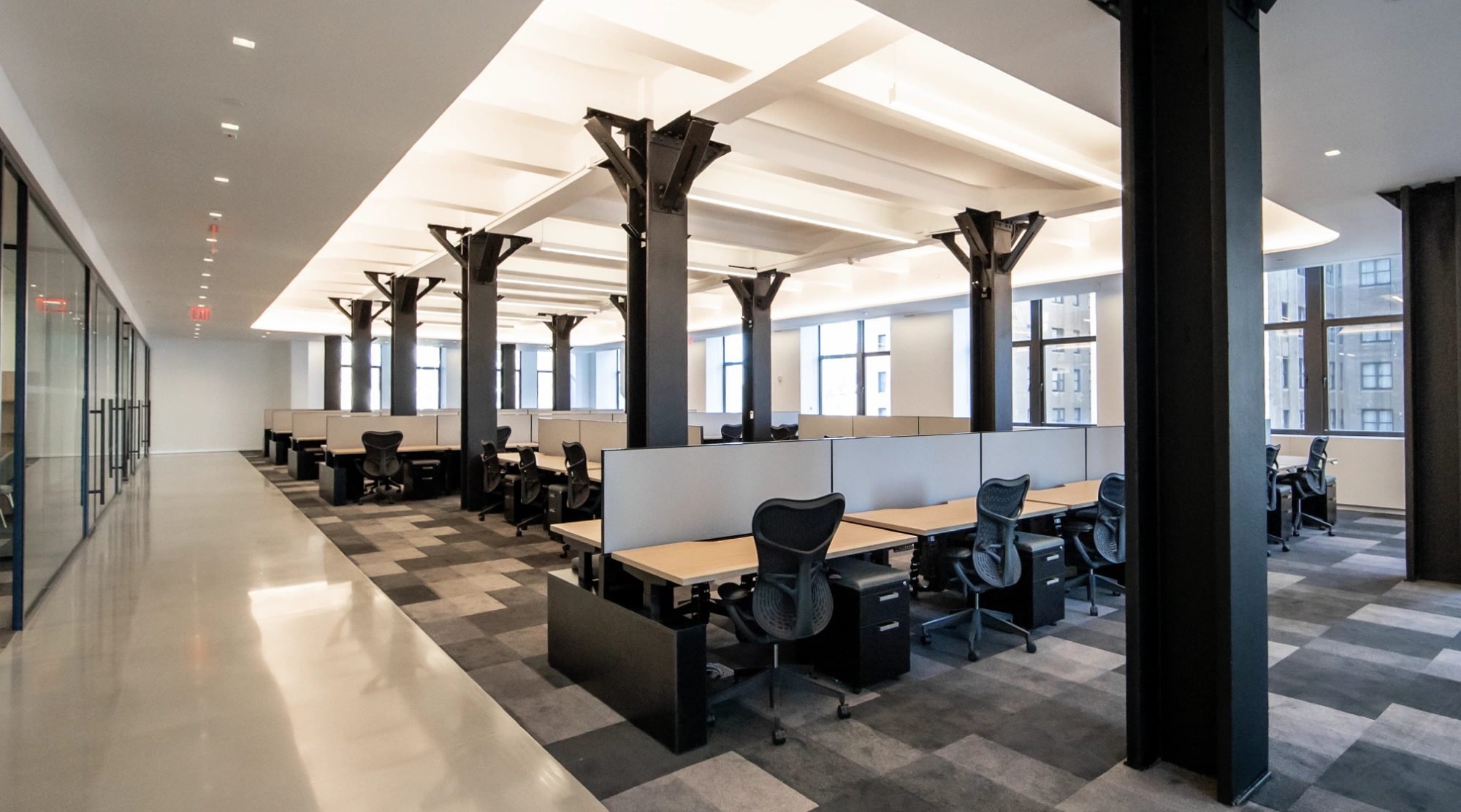 Move-in ready open concept workspace with black metal pillars 